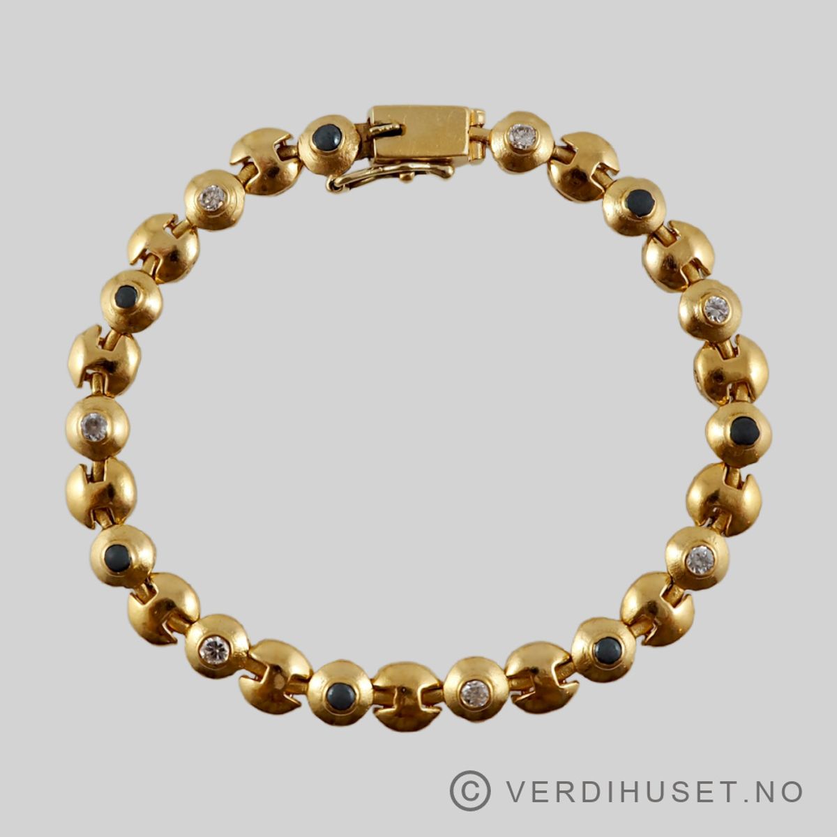 Armbånd i 22 K gull med grå og blanke stener